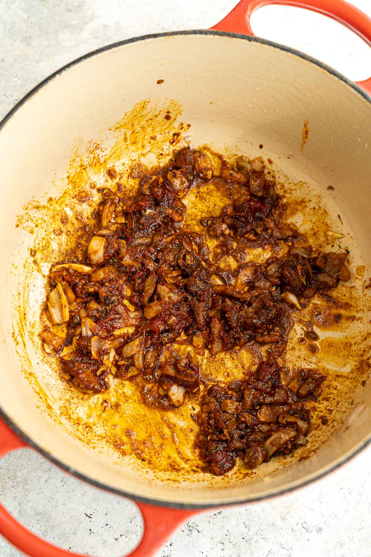 Stir frying onion, garlic, and spices.