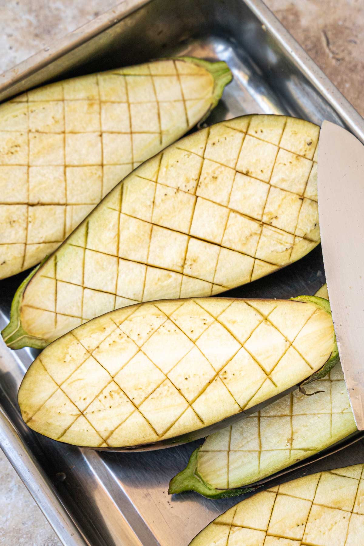 cutting the eggplants with diagonal cuts