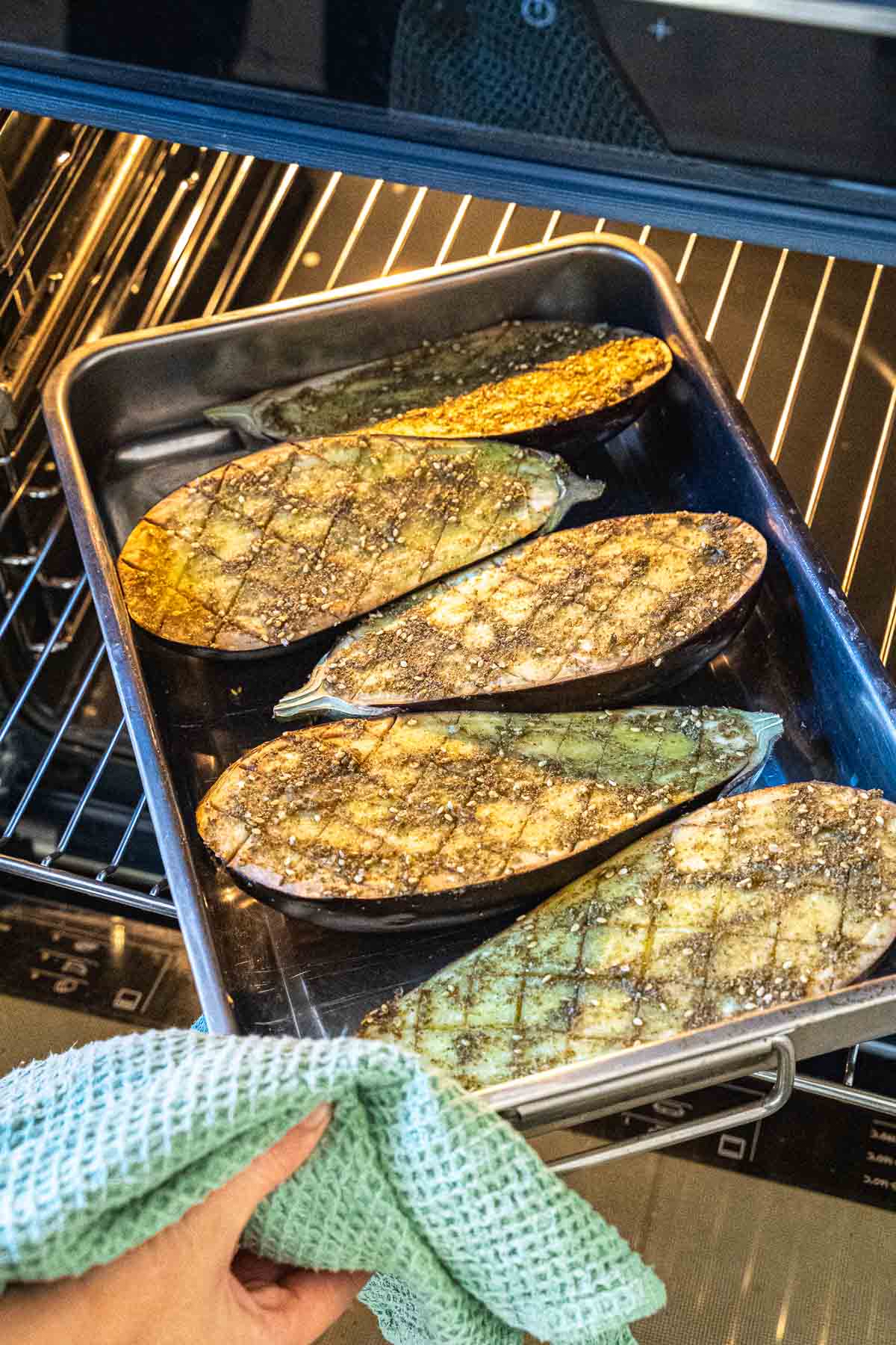 baking the eggplants with the marinade