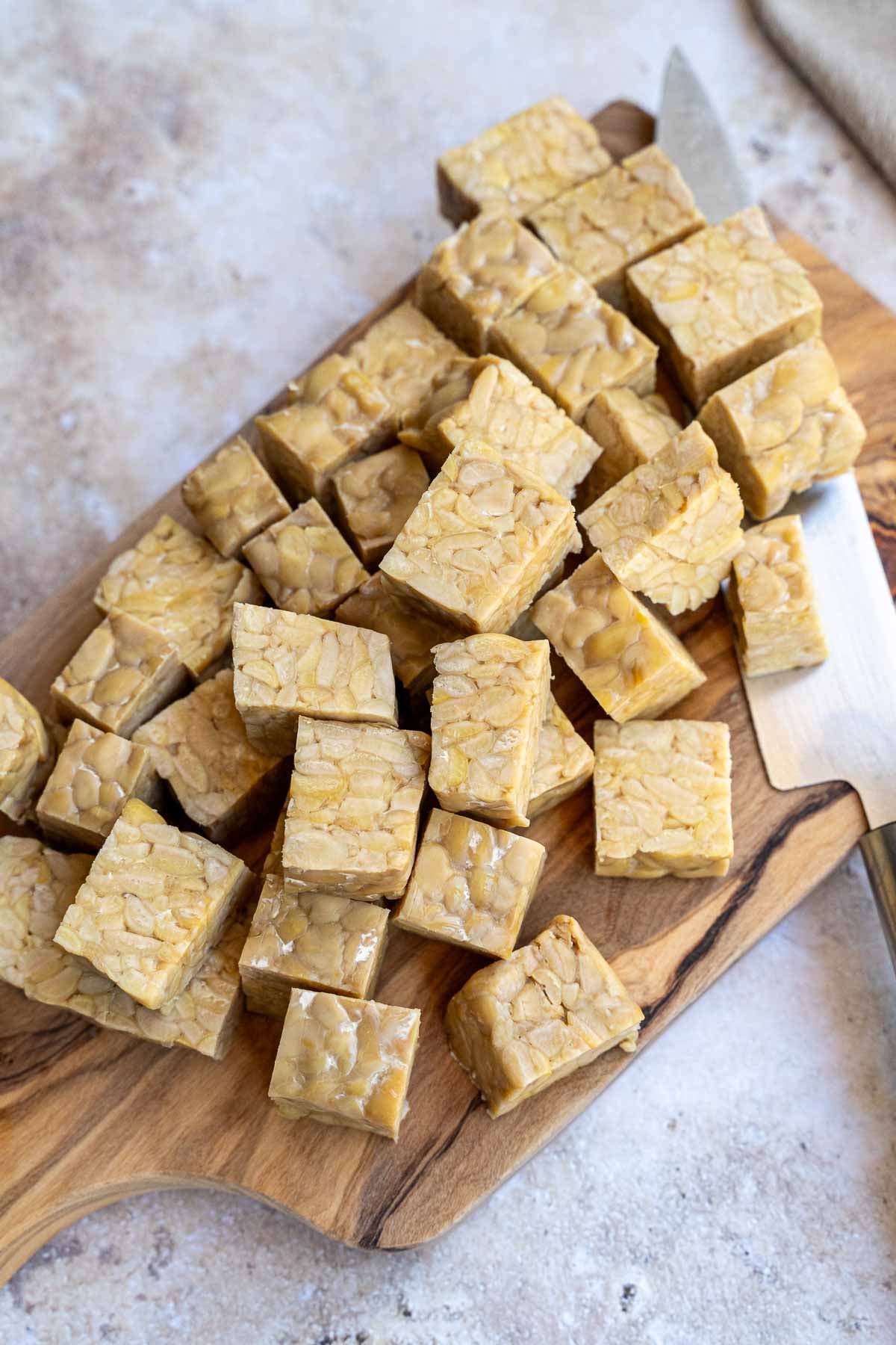 Cutting tempeh into cubes