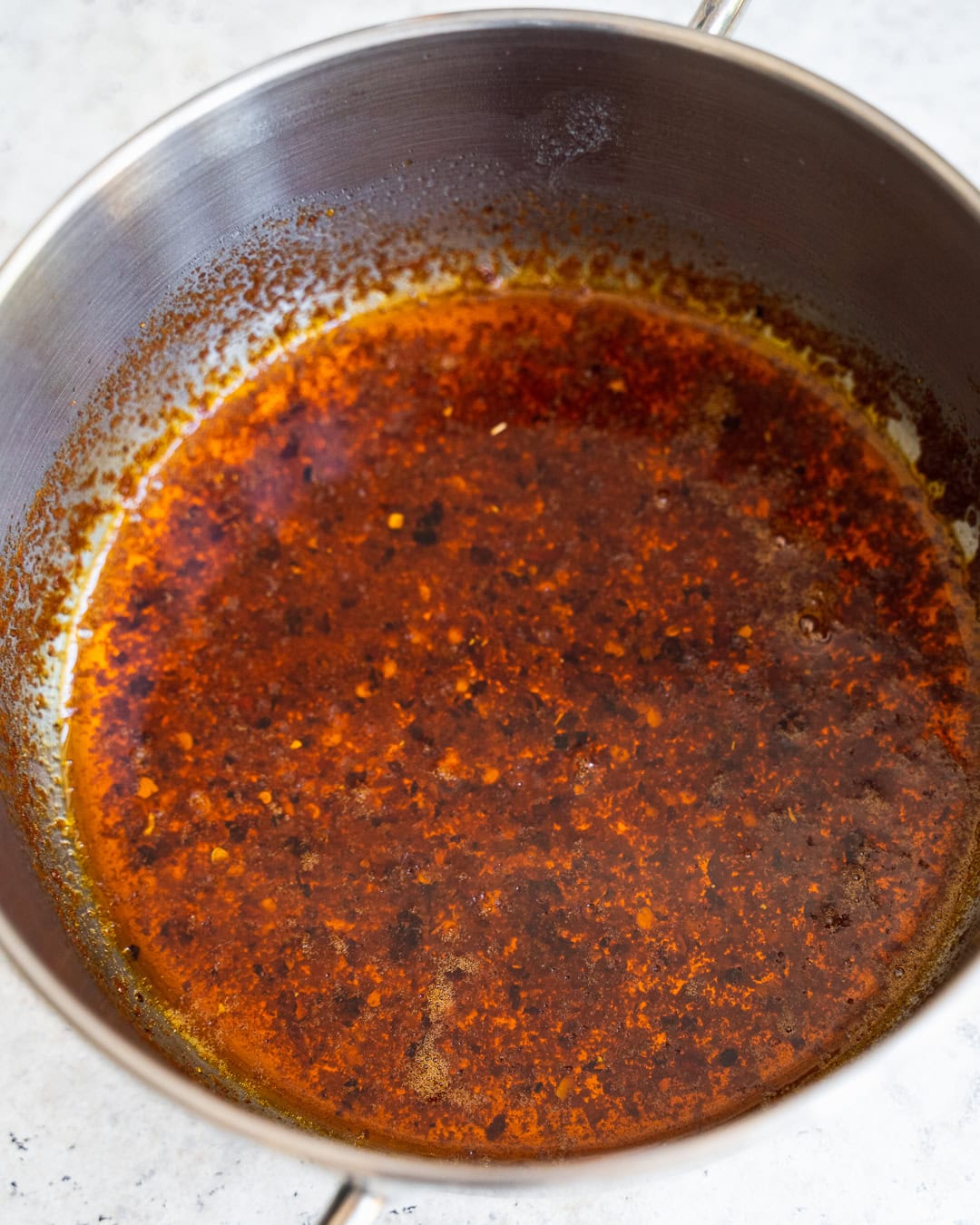 Cooking Chili-butter sauce for Turkish eggs