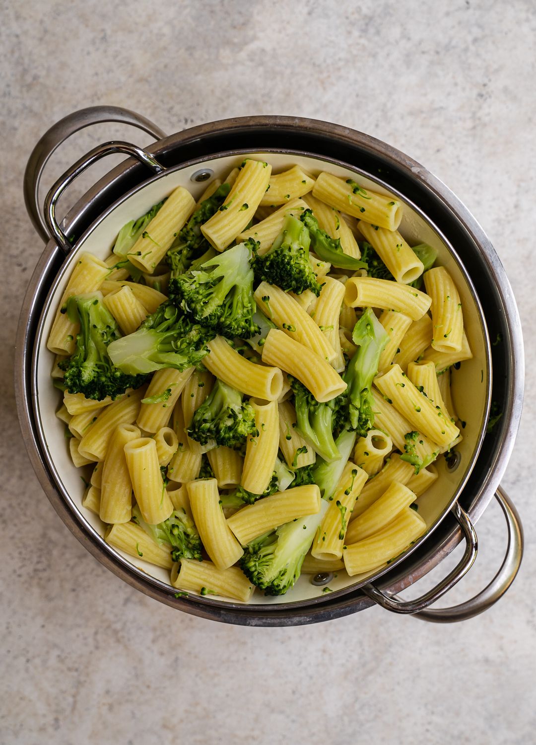 Draining the pasta and broccoli 