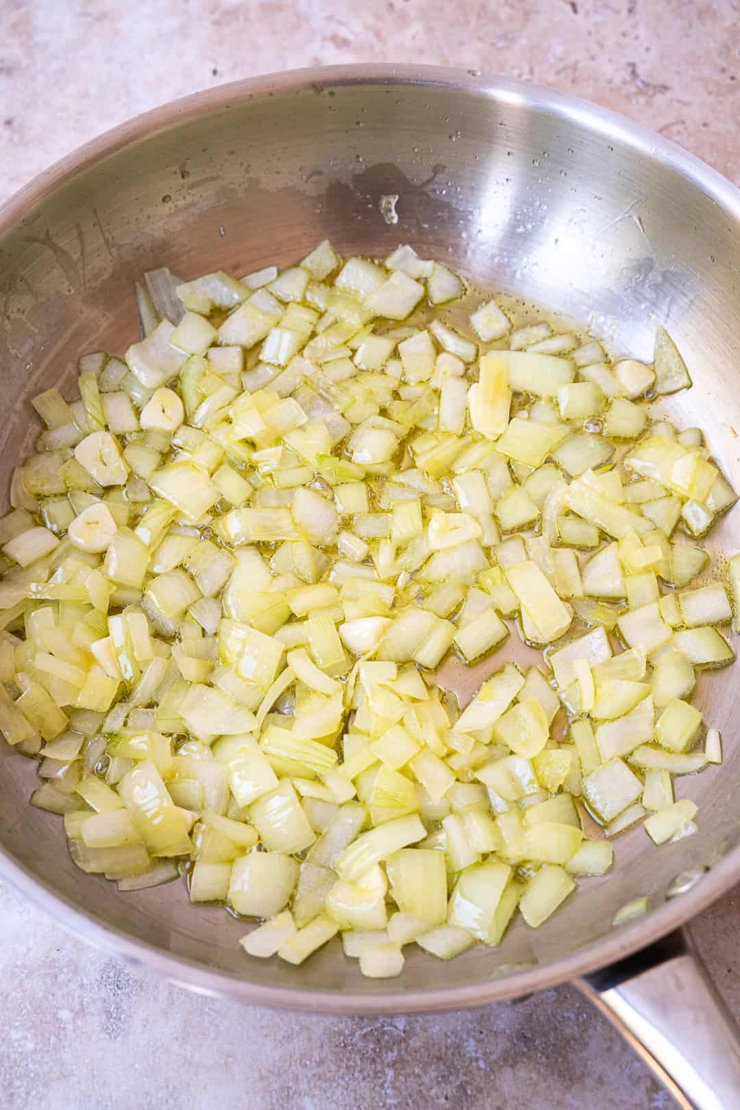 Heating olive oil and frying onions