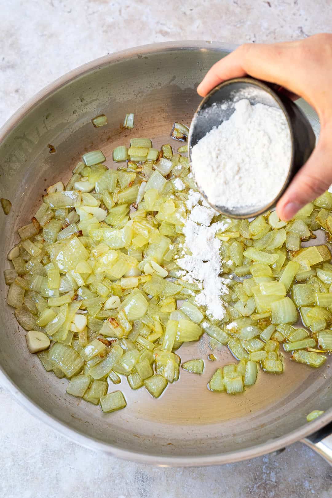 Adding flour to the pan