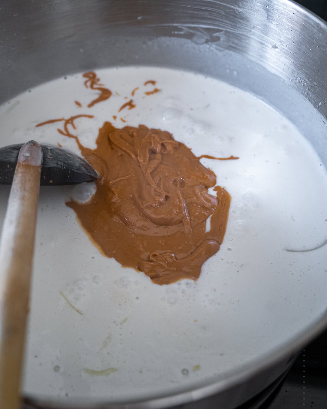 adding peanut butter with the coconut milk