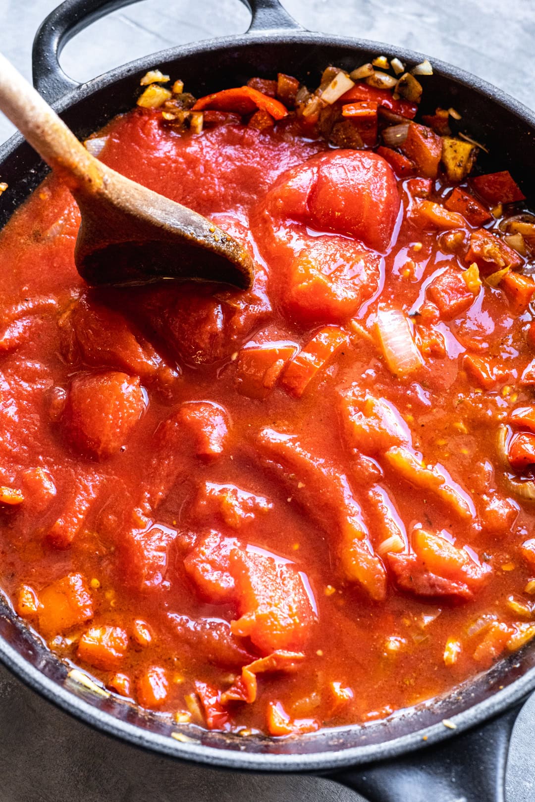 adding tinned tomatoes