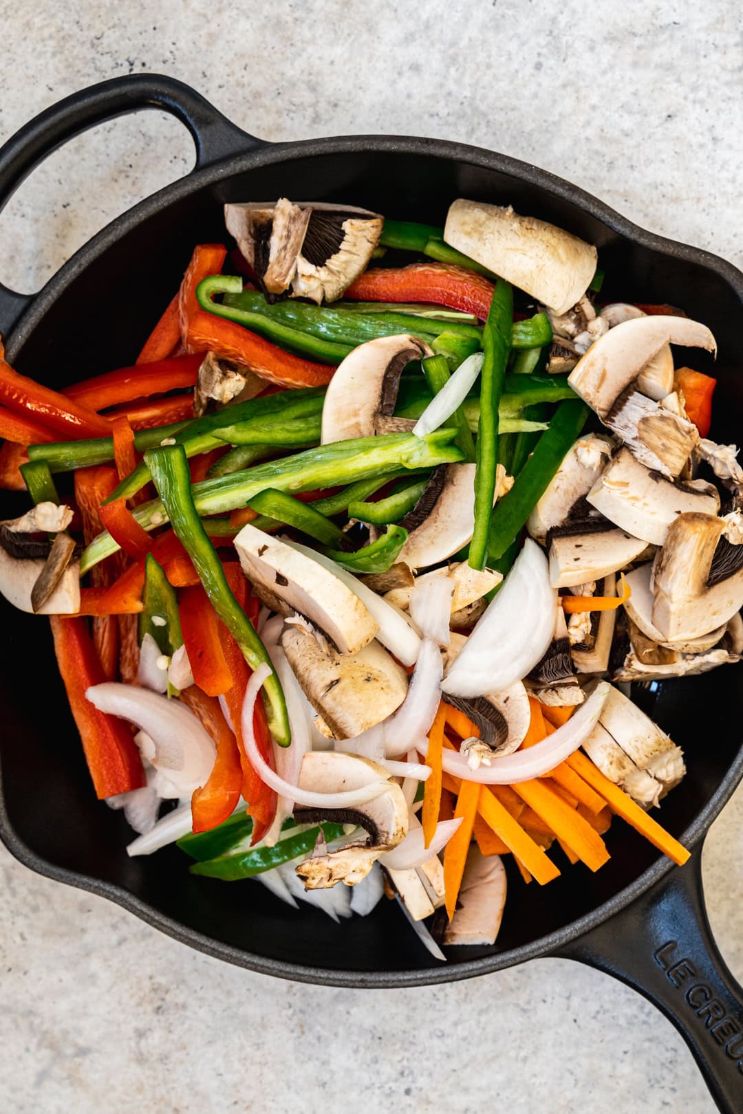 Adding all the ingredients to the skillet
