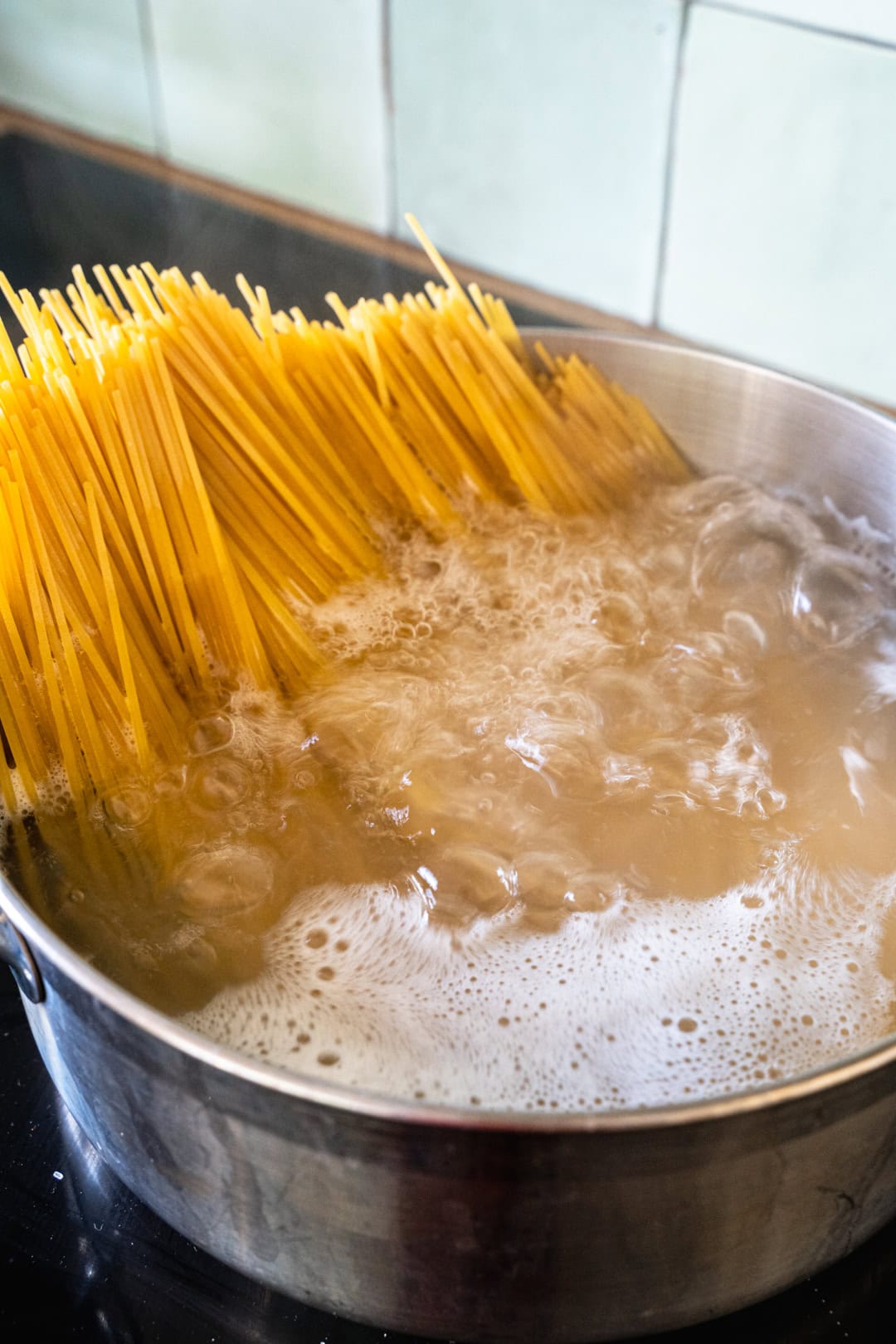 cooking the pasta in a big pot