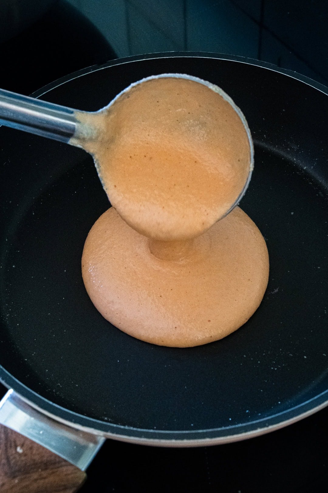 Pouring mixture on pan 